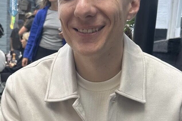 Hamish Hallett, Account Manager at Ranieri Agency, smiling outdoors.